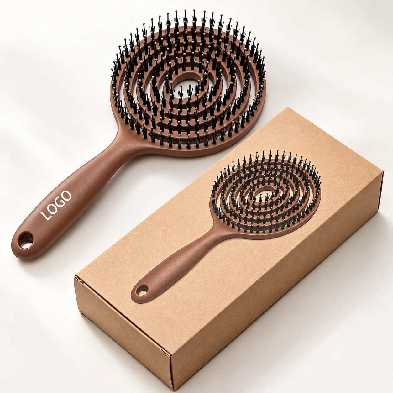BLC-1 spiral vented boar bristle hair brush with sample handle logo beside an illustrated kraft box