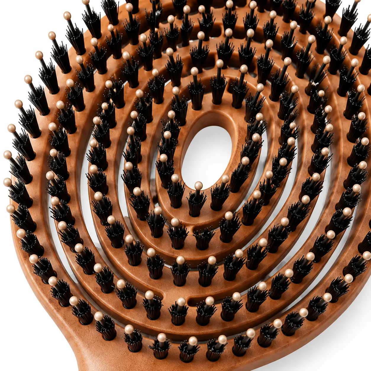 Close-up of the BLC-1 brush head showing spiral vents, ball-tipped pins and boar bristle tufts