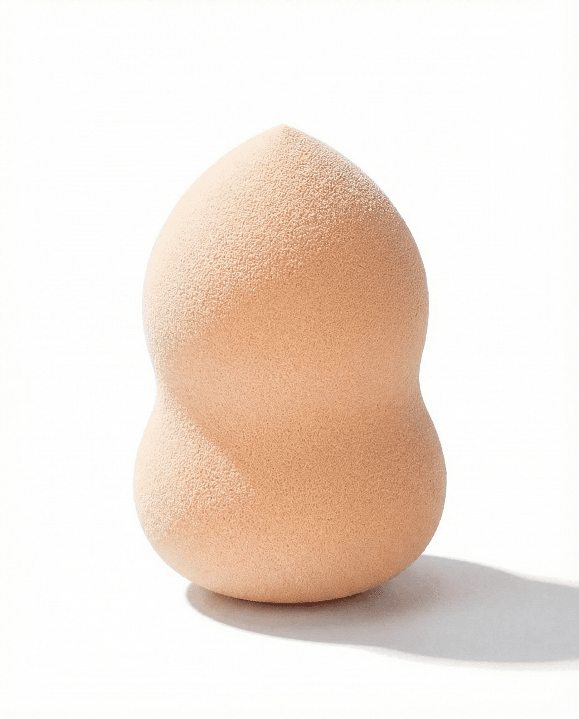 Contoured gourd-shaped makeup sponge with narrowed center