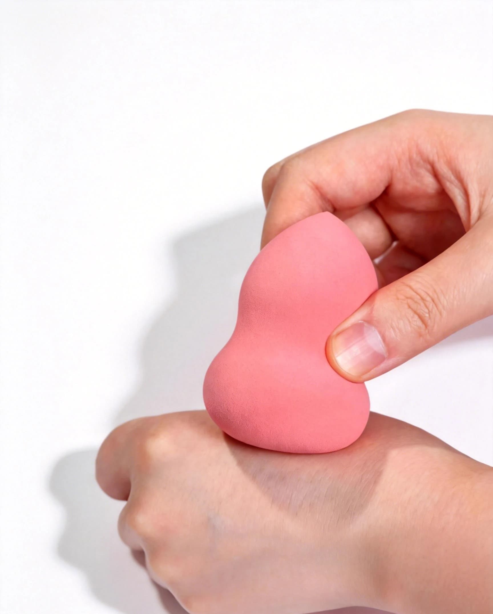 Pointed application end of a gourd-shaped makeup sponge