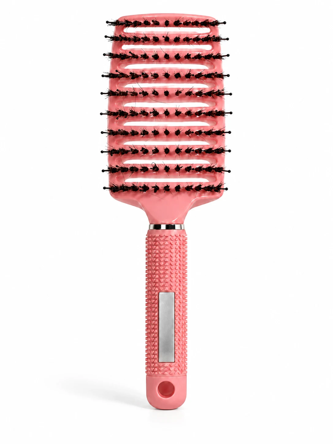 Pink curved vented brush showing longer pins and shorter bristle tufts