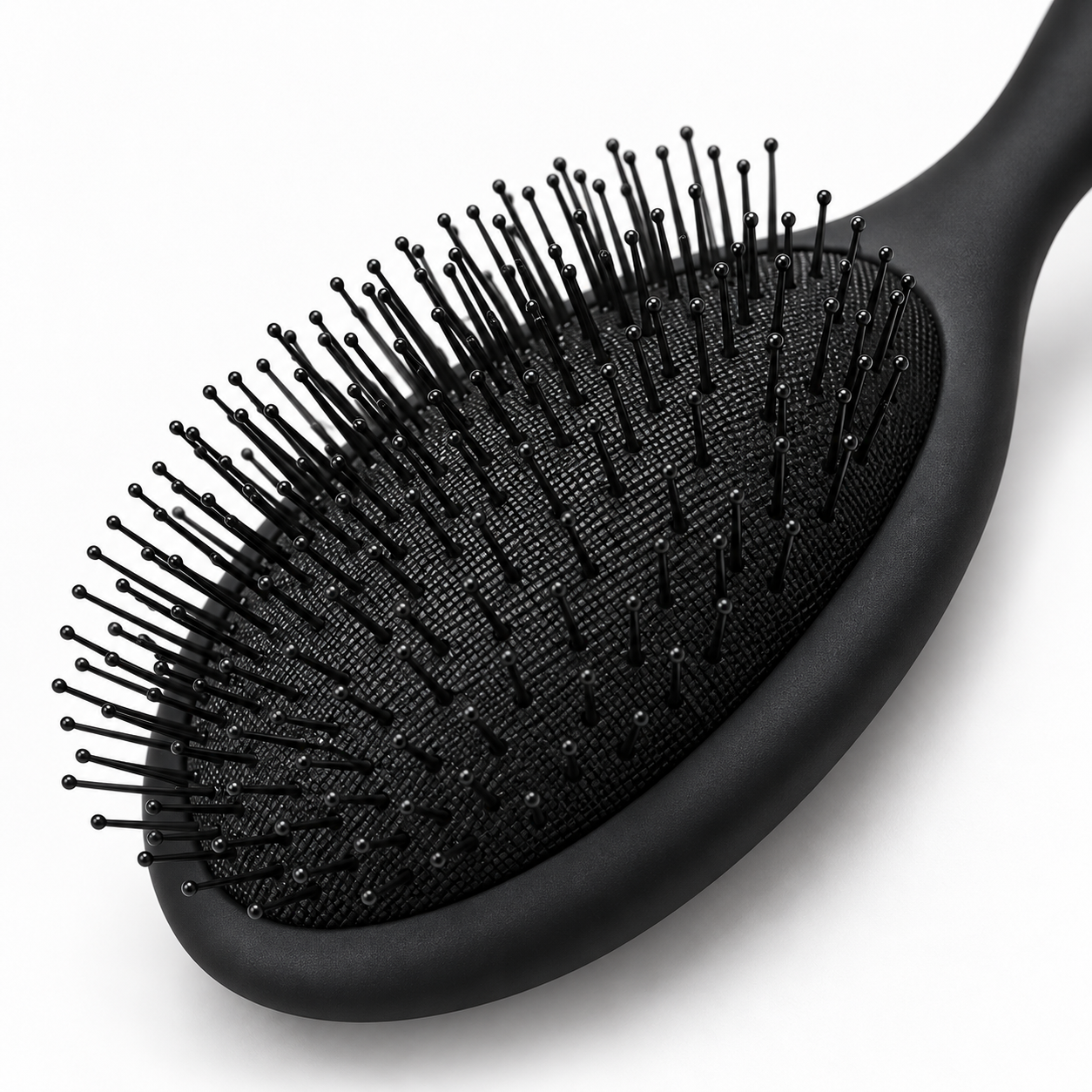 Close-up of the rounded nylon pins and cushion on a black BLC-04 hair brush