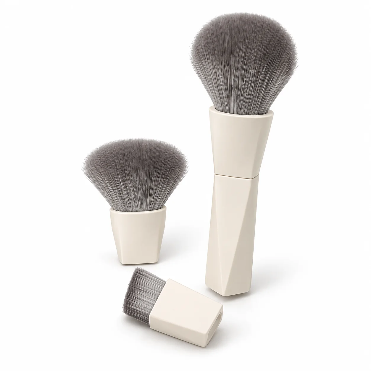 One ivory magnetic makeup brush handle with one attached head and two interchangeable heads