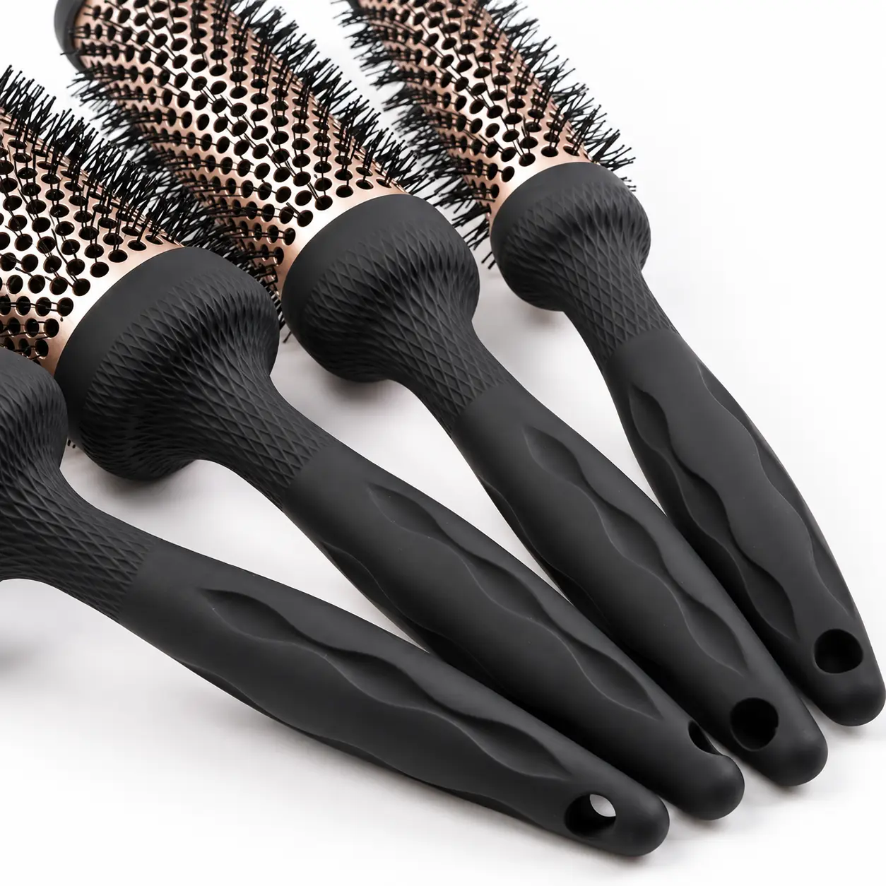 Textured black handles and hanging holes on the round blow dry brush range
